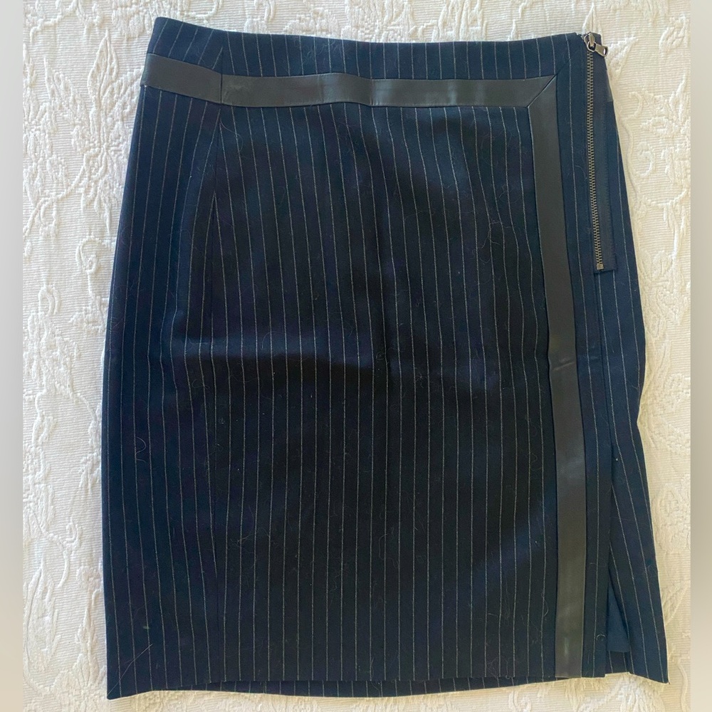Club Monaco navy pinstripe pencil skirt with leather details. Side zip and slit